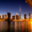 Overlooking harbour in Dubai at night with UHNW individual