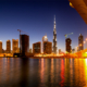 Overlooking harbour in Dubai at night with UHNW individual